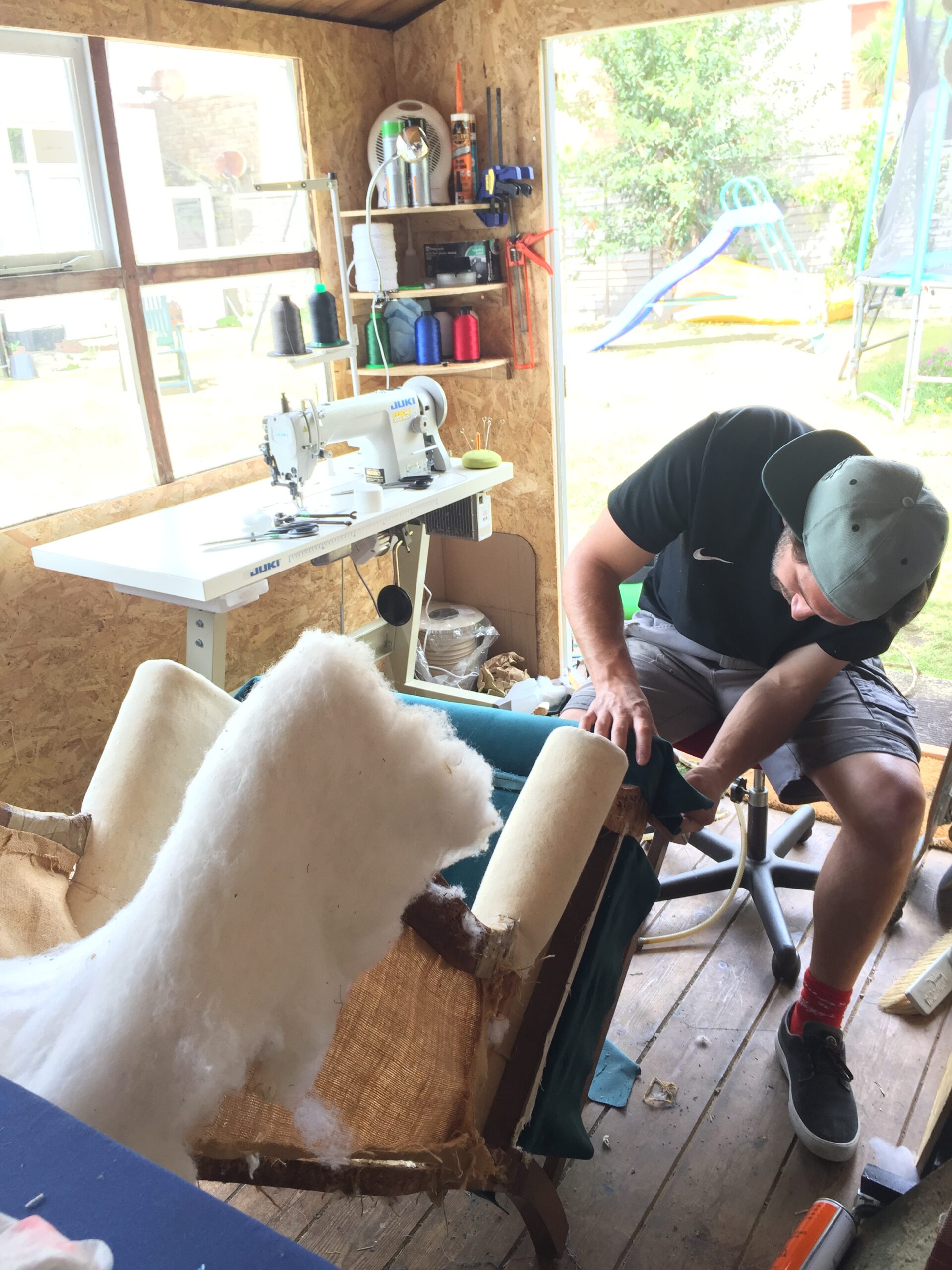 Andy working on a chair in the FT Upholstery workshop